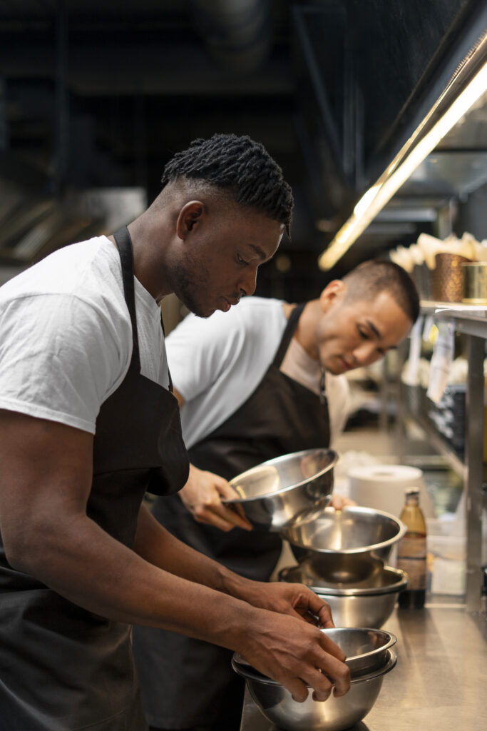 chef cooking kitchen while wearing professional attire